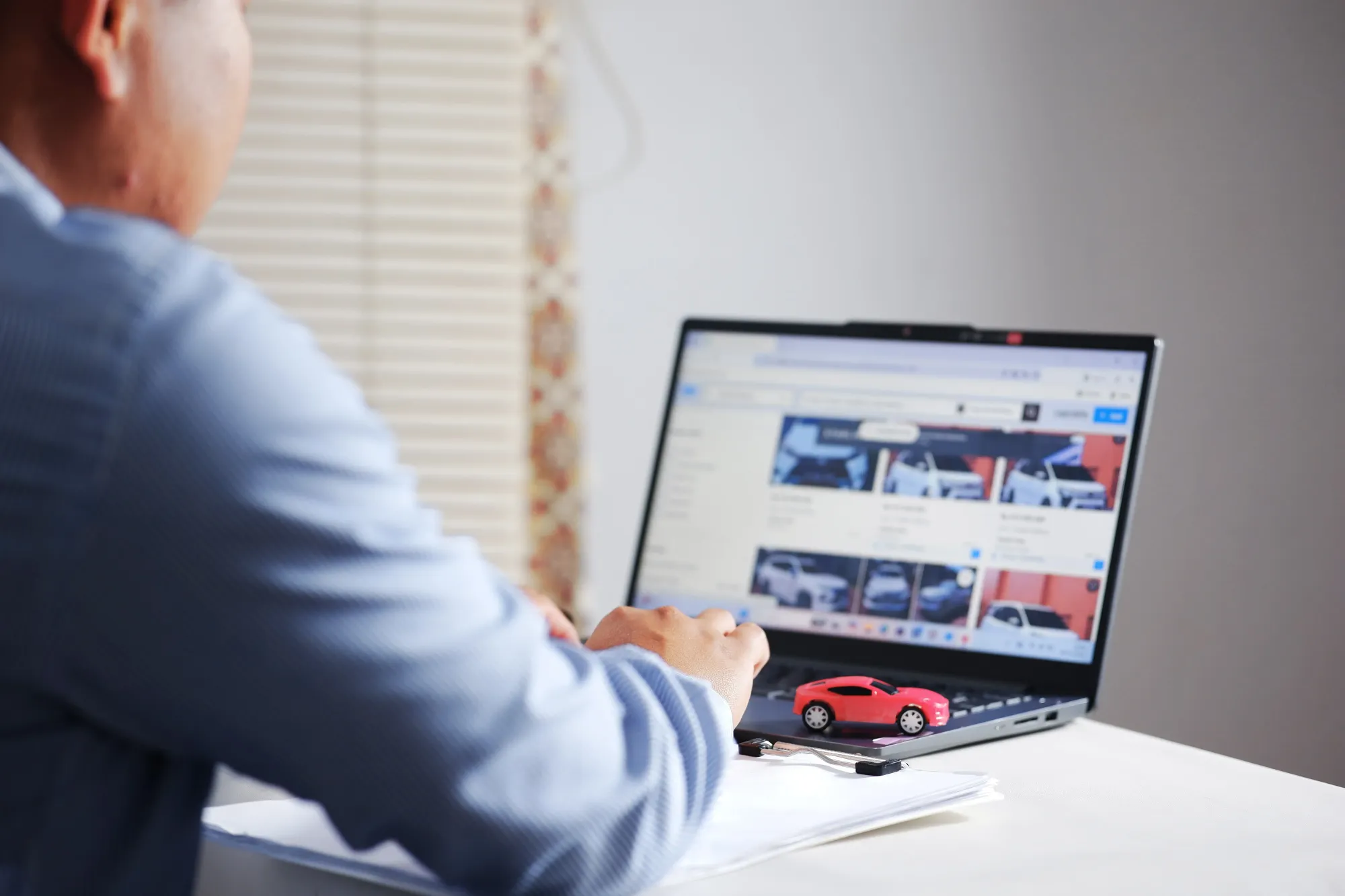 A man buying a car online.